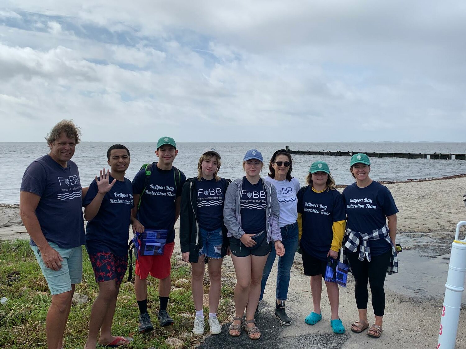 Four youngsters from the Boys & Girls Club of the Bellport Area joined interns from Friends of Bellport Bay to plant 60,000 oysters on bulkheads in the bay as part of an environmental education program funded by the David M. Duffy Jr. Foundation.